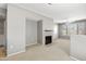 Open living room area with a fireplace, neutral paint, and access to the outdoor patio at 4925 E Desert Cove Ave # 350, Scottsdale, AZ 85254