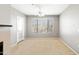 Inviting living room featuring neutral walls, carpet, and a sliding glass door leading to outdoor space at 4925 E Desert Cove Ave # 350, Scottsdale, AZ 85254