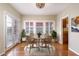Cozy dining room area with wicker furniture, lovely windows, and warm lighting, perfect for intimate gatherings at 1346 W Willetta St, Phoenix, AZ 85007