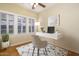 Comfortable home office space featuring a desk, chair, lots of natural light from the large windows at 1346 W Willetta St, Phoenix, AZ 85007