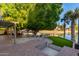 Charming outdoor space featuring a brick patio, pergola, and waterfront view, ideal for enjoying nature at 2107 S Paseo Loma --, Mesa, AZ 85202