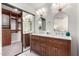 Bathroom featuring double sinks, vanity with lots of storage and a walk-in closet at 2107 S Paseo Loma --, Mesa, AZ 85202
