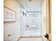 Modern bathroom with a glass-enclosed shower featuring neutral tile and a built-in bench at 2107 S Paseo Loma --, Mesa, AZ 85202