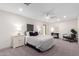 Bright bedroom with neutral tones, a ceiling fan, and a comfortable queen-sized bed at 2107 S Paseo Loma --, Mesa, AZ 85202