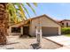 Charming home featuring desert landscaping, terracotta tile roof, and a two-car garage at 2107 S Paseo Loma --, Mesa, AZ 85202