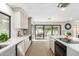 Updated kitchen with light cabinets, stainless steel appliances, and a large island overlooking an outdoor patio at 2107 S Paseo Loma --, Mesa, AZ 85202