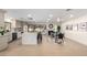 Open concept kitchen and dining area featuring a large island, stainless steel appliances, and fireplace at 2107 S Paseo Loma --, Mesa, AZ 85202