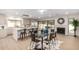 Bright and airy kitchen and dining area featuring a large island, stainless steel appliances, and fireplace at 2107 S Paseo Loma --, Mesa, AZ 85202