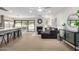 Open-concept living room with a fireplace, kitchen island, and access to the backyard at 2107 S Paseo Loma --, Mesa, AZ 85202