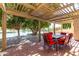 Inviting covered patio overlooking a serene pond, complete with outdoor dining set at 2107 S Paseo Loma --, Mesa, AZ 85202