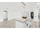 Kitchen island with granite countertop and seating at 6010 W Lewis Ave, Phoenix, AZ 85035