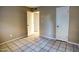 Bedroom with tile floors and doors to another room at 948 S Alma School Rd # 114, Mesa, AZ 85210