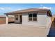 Backyard featuring a covered patio and low block wall providing shade and privacy to the residence at 16923 W Siesta Way, Goodyear, AZ 85338