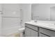 Bright bathroom with tub-shower combo, subway tile, and modern vanity at 16923 W Siesta Way, Goodyear, AZ 85338