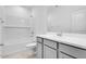 Bright bathroom with tub-shower combo, subway tile, and modern vanity at 16923 W Siesta Way, Goodyear, AZ 85338