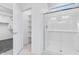 Stylish bathroom featuring a glass shower and walk-in closet access at 16923 W Siesta Way, Goodyear, AZ 85338