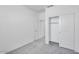 Bright bedroom with closet has neutral gray carpet and white walls at 16923 W Siesta Way, Goodyear, AZ 85338