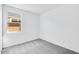 Bright bedroom has neutral gray carpet and a large single window at 16923 W Siesta Way, Goodyear, AZ 85338
