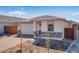 Charming single-story home with brick accents and a two-car garage at 16923 W Siesta Way, Goodyear, AZ 85338