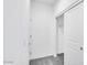 Hallway with neutral walls and plush carpeting, featuring closet with sliding doors at 16923 W Siesta Way, Goodyear, AZ 85338