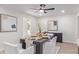 Modern dining room with a dark wood table and white chairs at 276 S Hacienda Cir, Litchfield Park, AZ 85340