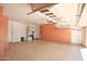 This well-lit garage provides custom wood cabinets, water heater, and an epoxy coated floor at 27789 N 129Th Ln, Peoria, AZ 85383