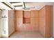 Spacious garage features custom wood cabinets with shelving providing ample storage space at 27789 N 129Th Ln, Peoria, AZ 85383