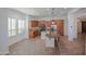 Well-lit kitchen with wooden cabinets, granite countertops, stainless appliances, and breakfast bar at 27789 N 129Th Ln, Peoria, AZ 85383