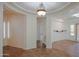 Neutral living space features earth tone tile, archways and recessed lighting at 27789 N 129Th Ln, Peoria, AZ 85383