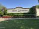 The Circle G Ranches community sign is surrounded by meticulously manicured landscaping, plants, and green grass at 2166 E Caroline Ln, Tempe, AZ 85284
