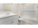 Clean bathroom with a white vanity, bathtub, and tiled shower at 5026 W Top Hand Trl, Laveen, AZ 85339