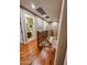 Upstairs hallway with hardwood floors and bathroom access at 19428 W Colter St, Litchfield Park, AZ 85340