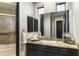Bathroom with granite vanity and glass shower at 27264 N 103Rd Way, Scottsdale, AZ 85262