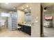 Elegant bathroom with glass block shower, soaking tub, and dual vanities at 27264 N 103Rd Way, Scottsdale, AZ 85262