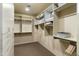 Large walk-in closet with ample shelving and hanging space at 27264 N 103Rd Way, Scottsdale, AZ 85262