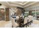 Formal dining room with stone accents and view to living room at 27264 N 103Rd Way, Scottsdale, AZ 85262