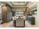 Spacious dining area with stone wall and large windows at 27264 N 103Rd Way, Scottsdale, AZ 85262