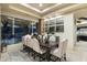 Elegant dining room with large windows and stone accents at 27264 N 103Rd Way, Scottsdale, AZ 85262