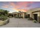 Stunning desert home with stone accents and a circular driveway at 27264 N 103Rd Way, Scottsdale, AZ 85262