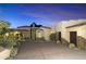 Luxury home with circular driveway and desert landscaping at 27264 N 103Rd Way, Scottsdale, AZ 85262