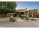 Inviting entryway with a stone walkway and lush landscaping at 27264 N 103Rd Way, Scottsdale, AZ 85262