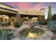 Relaxing hot tub surrounded by flagstone and desert landscaping at 27264 N 103Rd Way, Scottsdale, AZ 85262