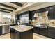 Modern kitchen featuring stainless steel appliances and dark wood cabinetry at 27264 N 103Rd Way, Scottsdale, AZ 85262