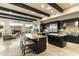 Gourmet kitchen with granite island, stainless steel appliances, and dark wood cabinetry at 27264 N 103Rd Way, Scottsdale, AZ 85262
