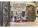 Spacious living area with stone fireplace and large windows at 27264 N 103Rd Way, Scottsdale, AZ 85262