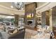 Open living space featuring a stone fireplace and hardwood floors at 27264 N 103Rd Way, Scottsdale, AZ 85262