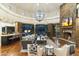Open living space featuring a stone fireplace and hardwood floors at 27264 N 103Rd Way, Scottsdale, AZ 85262