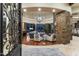 Spacious living area with stone fireplace and large windows at 27264 N 103Rd Way, Scottsdale, AZ 85262