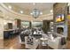 Open living space featuring a stone fireplace and hardwood floors at 27264 N 103Rd Way, Scottsdale, AZ 85262