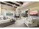 Main bedroom with fireplace, sitting area, and large windows at 27264 N 103Rd Way, Scottsdale, AZ 85262
